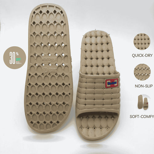 Beige slide sandal with textured sole on a white background, featuring quick-dry, non-slip, and soft-comfy properties.