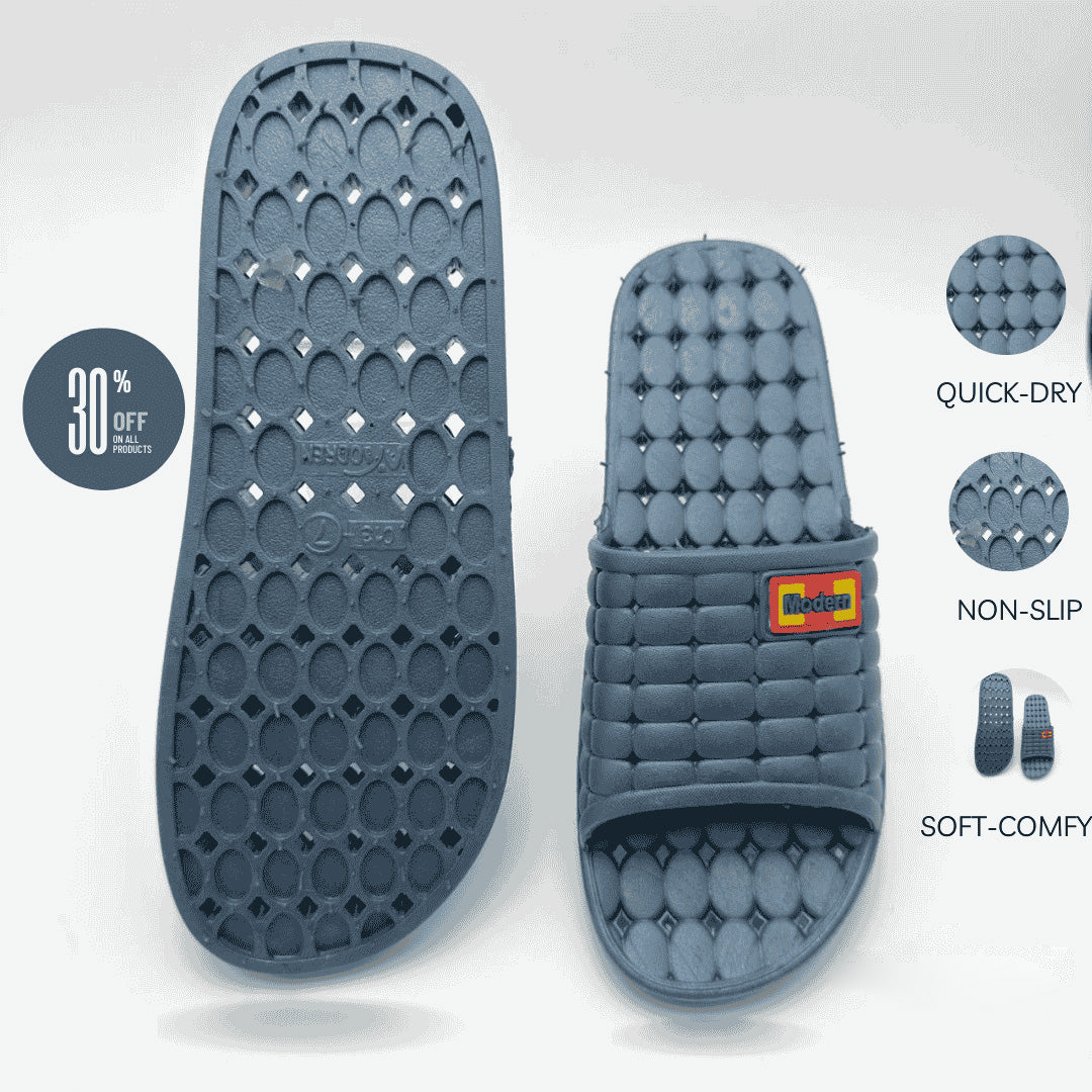 Gray slide sandal with textured sole and brand logo on a light gray background